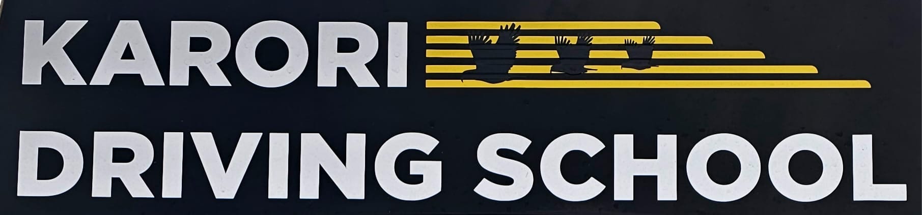 Karori Driving School sign with bird silhouettes