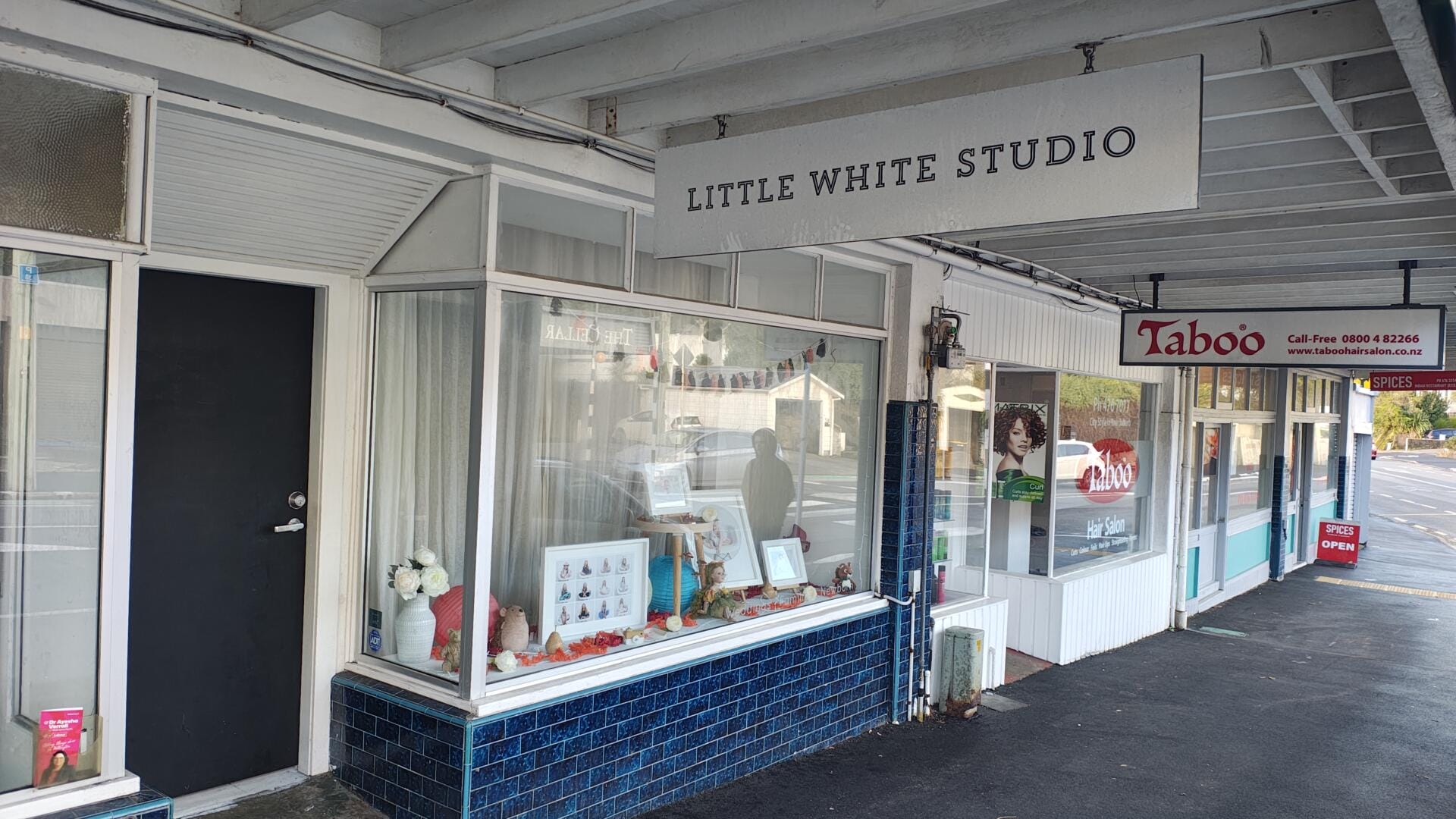 Little White Studio and nearby hair salon storefronts