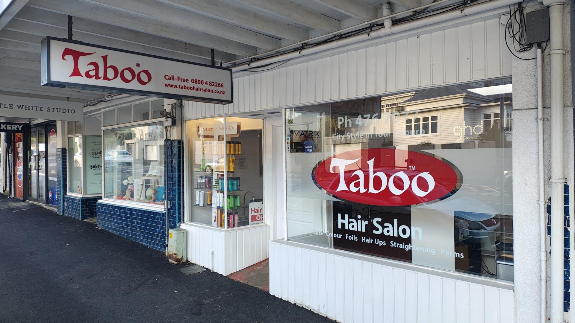Taboo Hair Salon storefront on suburban street