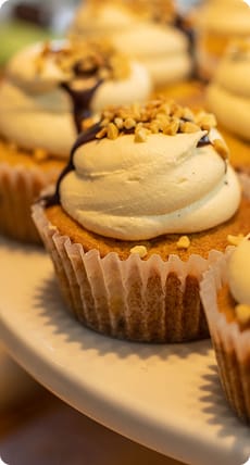 Caramel cupcakes with cream frosting and nuts