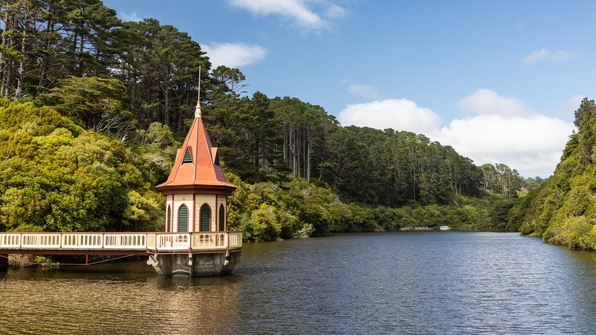Ornate water tower on forested lake